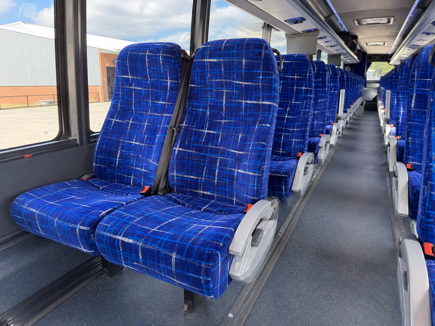 rather than splitting into multiple cars keep your whole group together on one bus